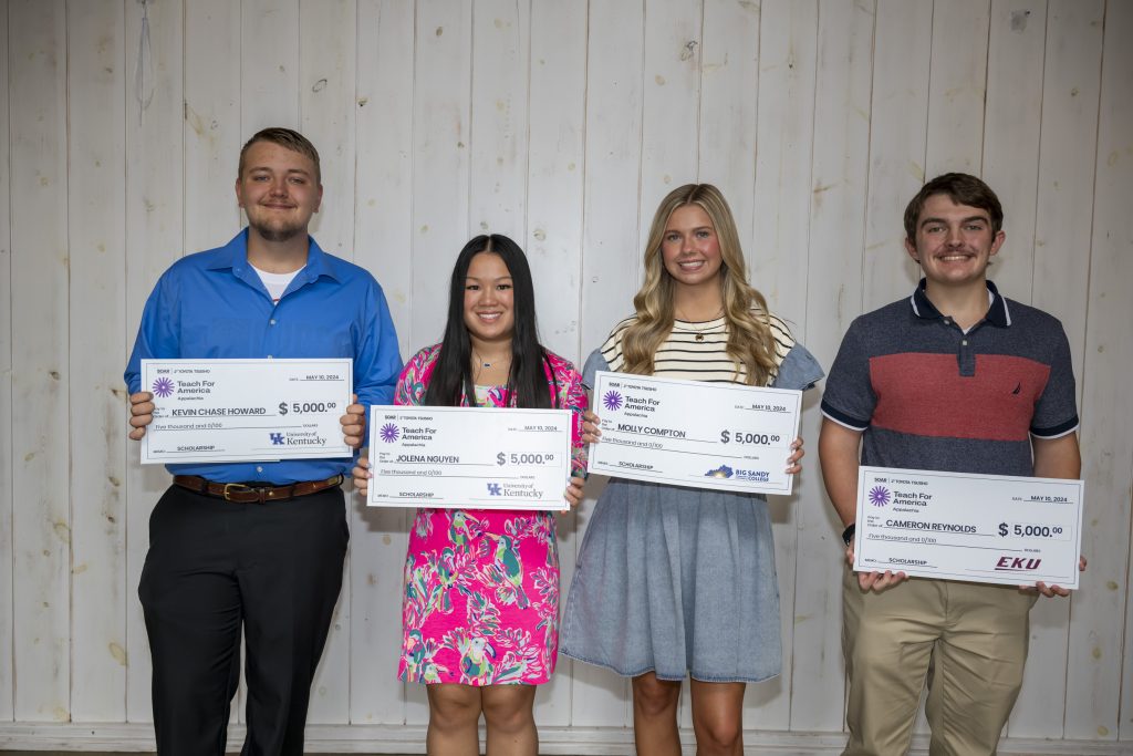 The four recipients of the scholarship, made possible by TAI and SOAR, pose for a picture